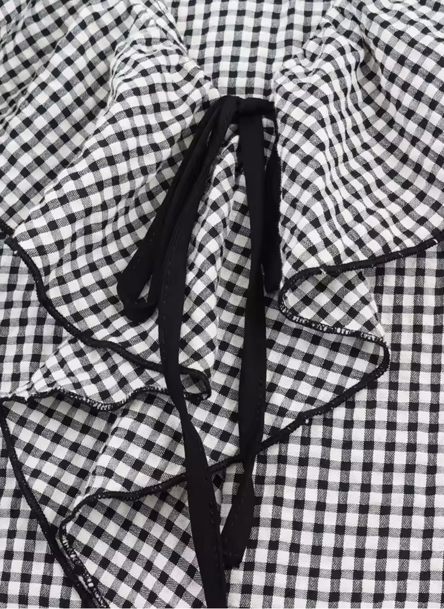 SARA - Blusa a cuadros con volantes